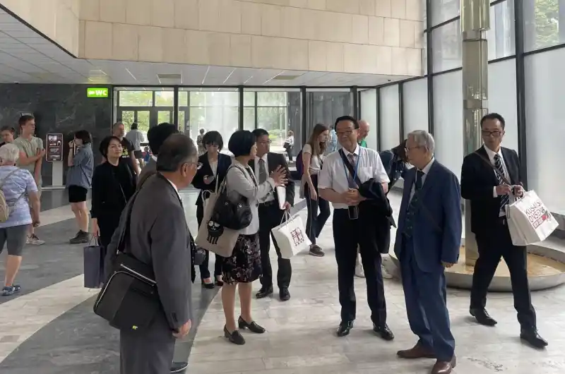 Delegace Kusatsu v KV